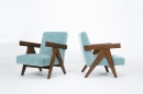Pierre Jeanneret's Pair of "Upholstered Easy" lounge chairs, full side and front diagonal views