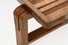 Jacques Adnet's coffee table/bench detailed view of leather and wood