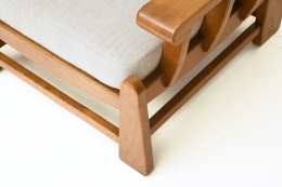Maison Regain's pair of armchairs, detailed view of upholstery and wood frame