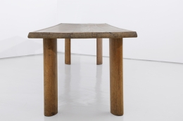 Charlotte Perriand's "Table a gorge" dining table, full view from one end of the table